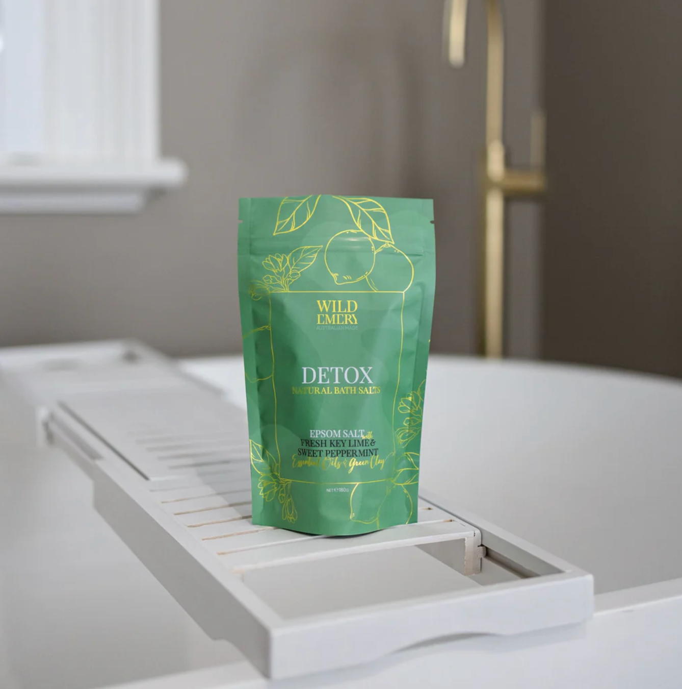 Green package of Wild Emory Detox bath salts on a white surface